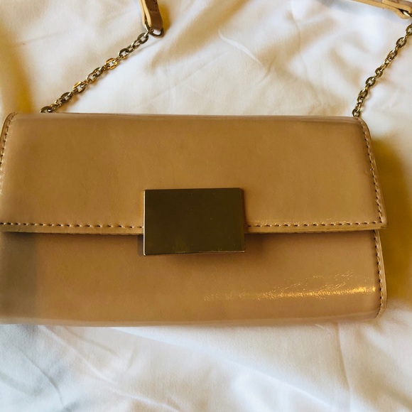 A gorgeous crossover tan clutch w/ gold hardware - Picture 2 of 4